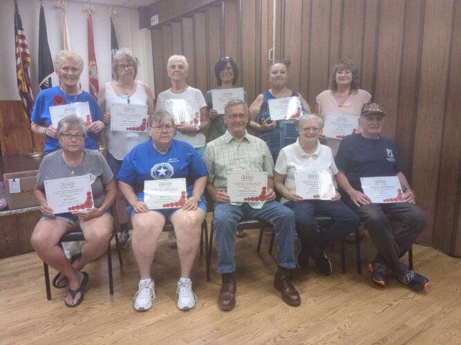 Legion volunteers collect for poppies